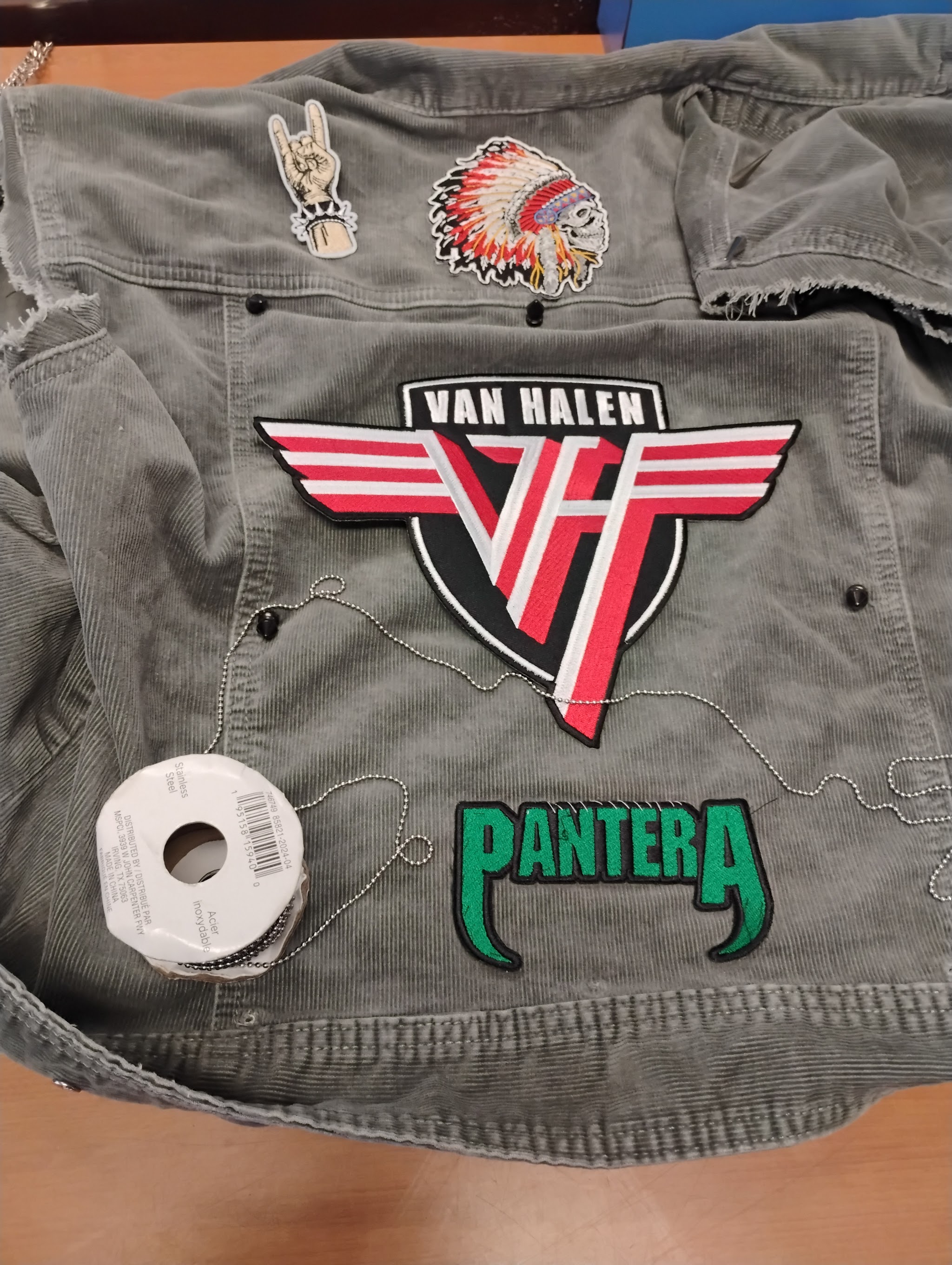 Custom patch sewing work on corduroy jacket