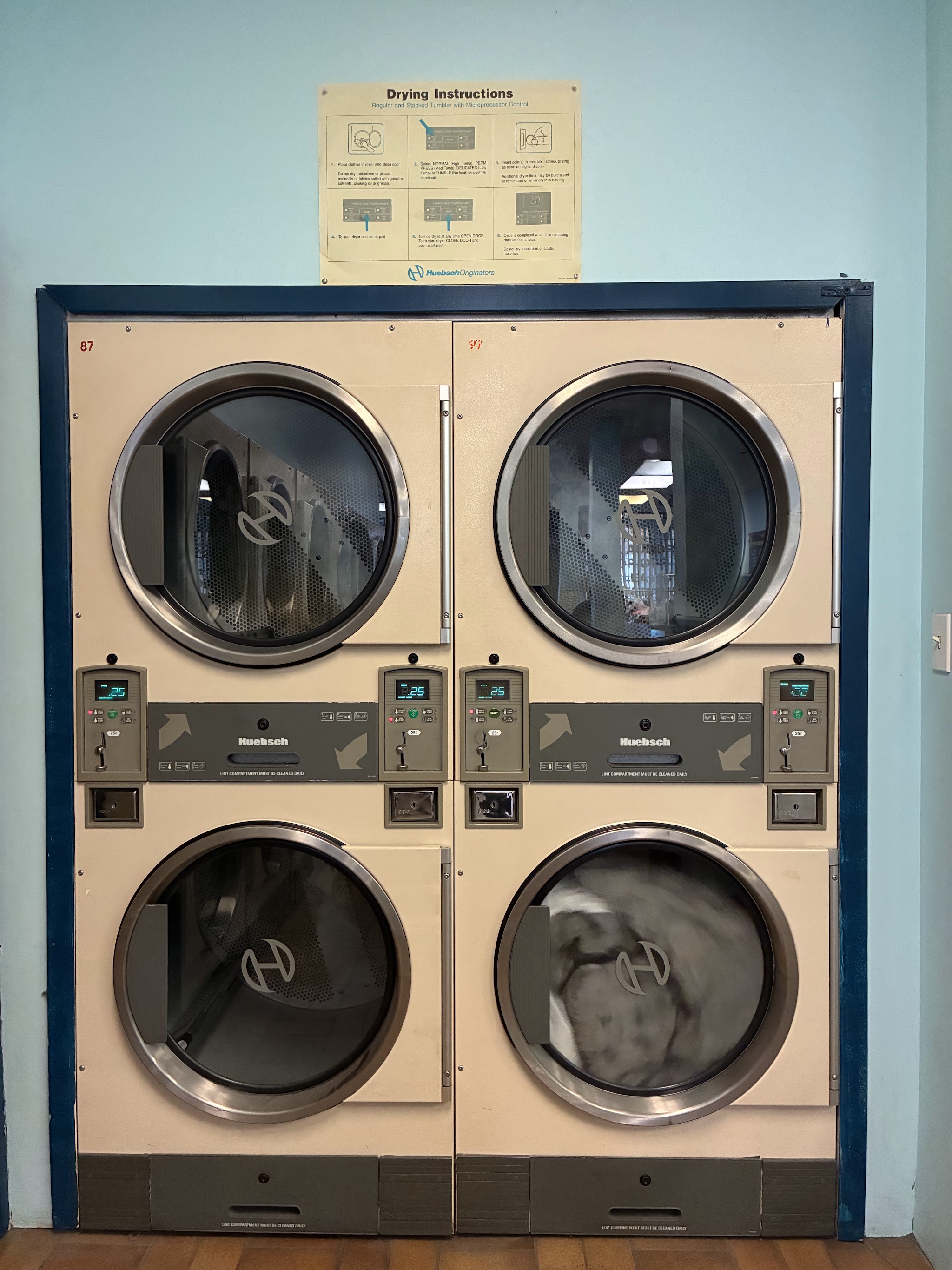 Stacked Huebsch commercial dryers