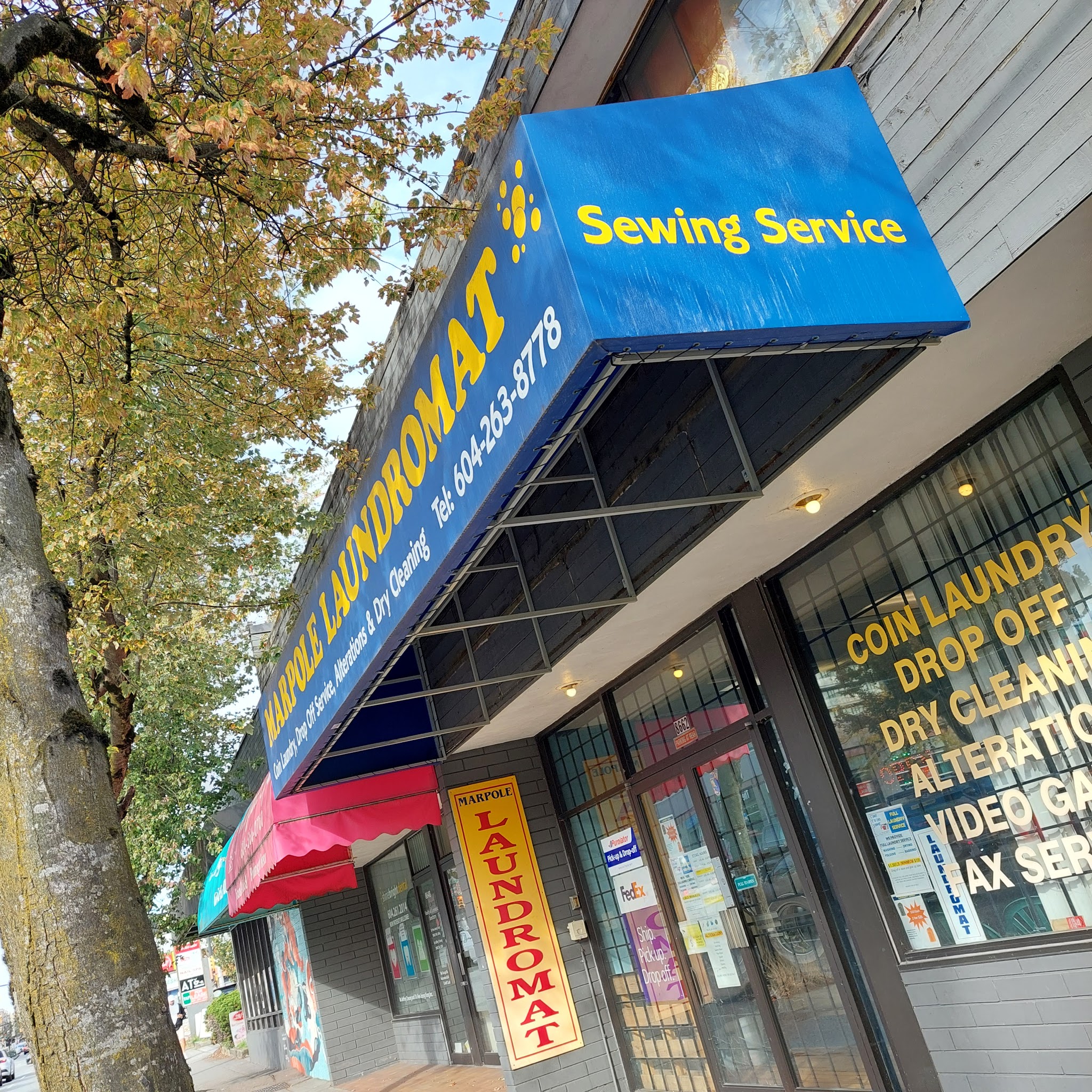 Blue Sewing Service awning on Granville Street
