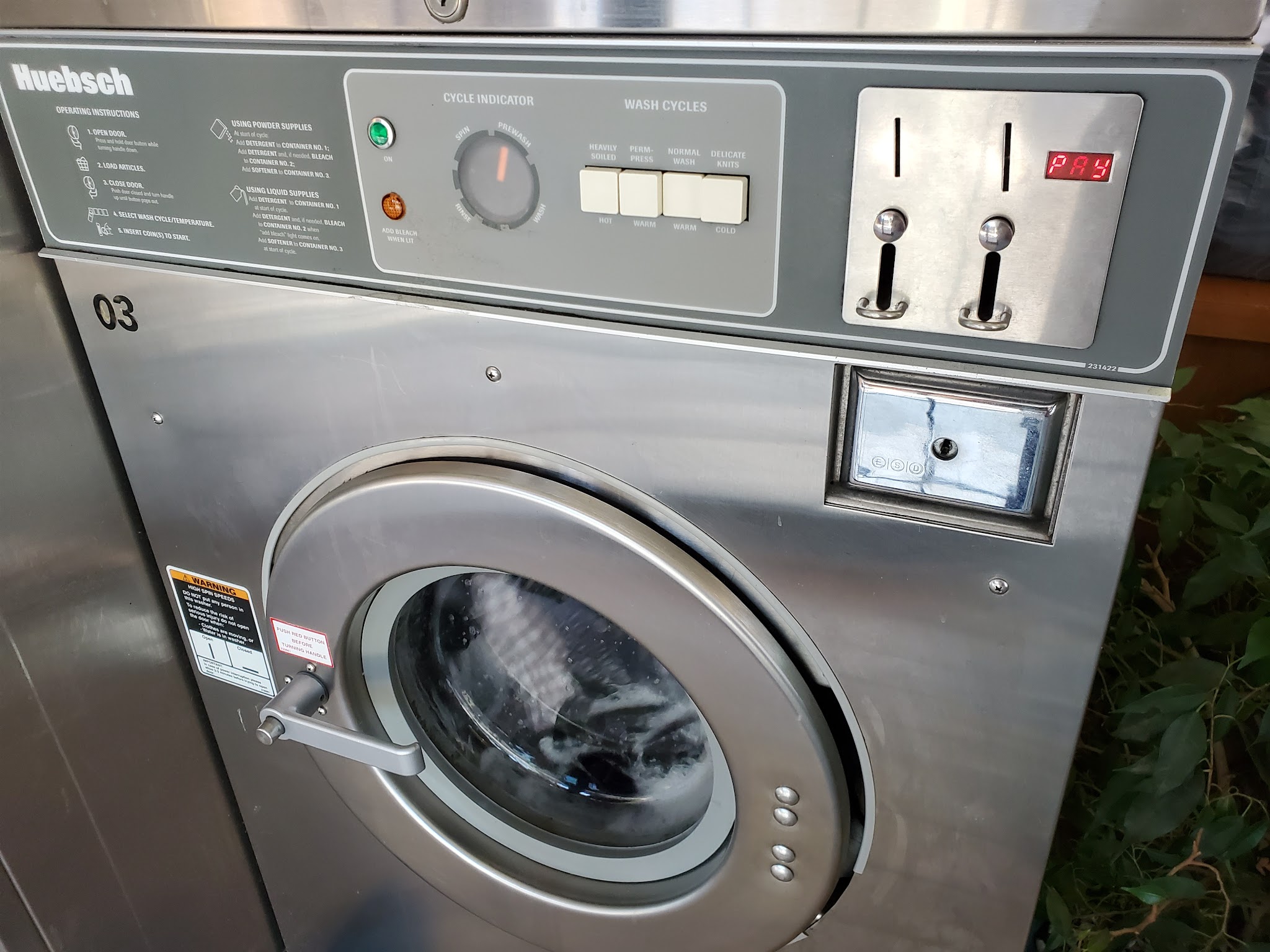 Close-up of Huebsch commercial washer controls