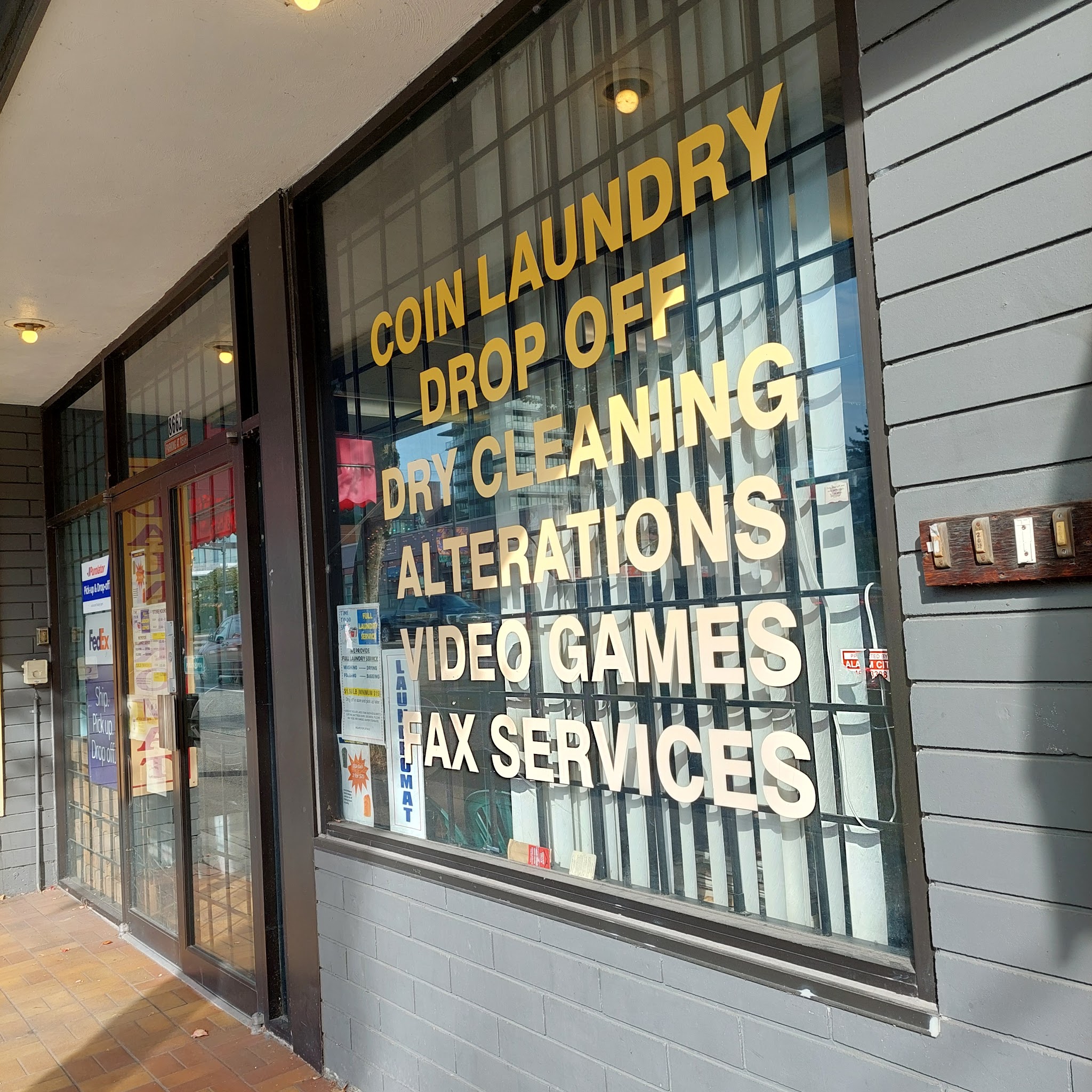 Window with gold lettering listing all services